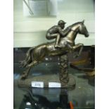 A cast figure of racehorse with jockey