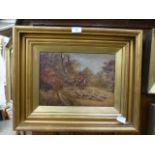 A gilt framed oil on board of hunt scene