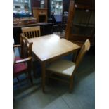 A modern oak extending kitchen table alo