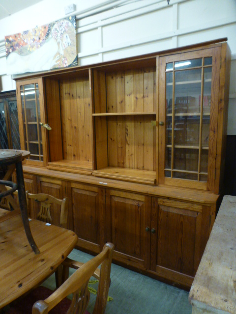 A pine dresser the top with open storage