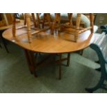 A mid-20th century teak drop-leaf dining