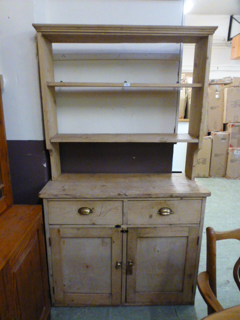 A 19th century pine dresser, the plate r