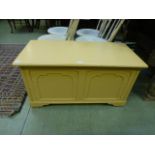 A yellow painted early 20th century blan