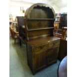 A reproduction oak dresser, the arched t