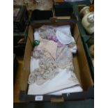 A tray of linen and lace ware