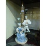 A NAO ceramic figural lamp in the form o