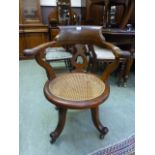 A 19th century mahogany swivel office ch