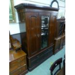 A late 19th century mahogany wardrobe, t