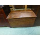 An early 20th century oak blanket box wi