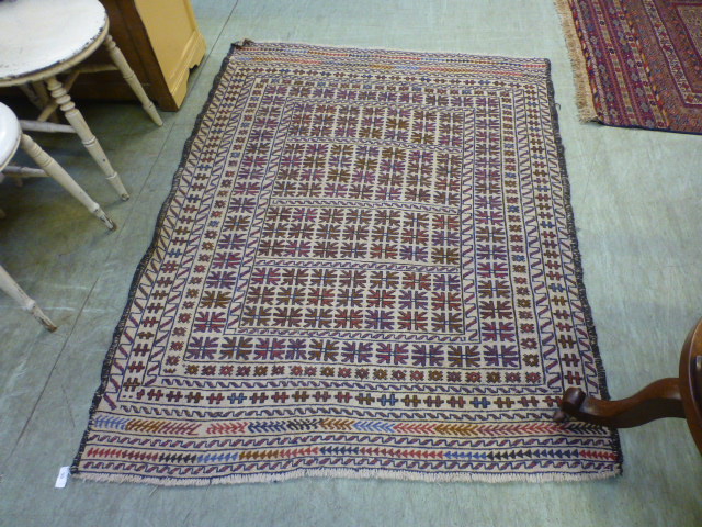 A hand woven Turkish rug with geometric