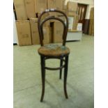 A 19th century bentwood correction chair