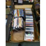 A tray containing DVDs and CDs