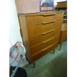 A mid-20th century teak chest of five dr