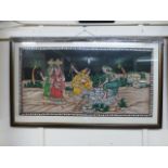 A framed and glazed Indian print on cott