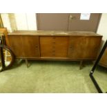 A mid-20th century teak sideboard having