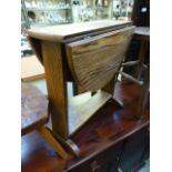 A small oak drop-leaf table