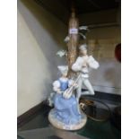 A NAO ceramic figural lamp in the form o