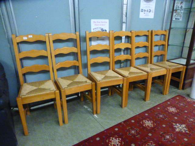 A set of six ladder back kitchen chairs