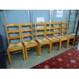 A set of six ladder back kitchen chairs