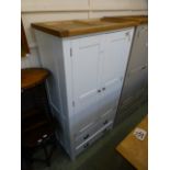 A white painted two door kitchen larder