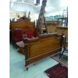 A continental walnut bedstead