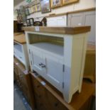 A white painted corner TV cabinet with t