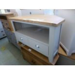 A grey painted corner TV cabinet with tw