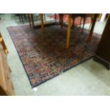 A modern blue ground rug with foliate de