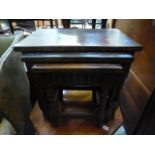 A nest of three oak occasional tables