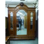 An early 20th century walnut wardrobe ha