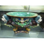 A Majolica planter, the bowl supported b