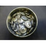 A tin of American military buttons