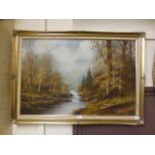 A gilt framed oil on canvas of river thr