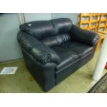 A charcoal grey leather two seat sofa