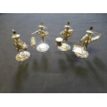 Four white metal eastern figures carryin