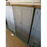 A grey painted two door kitchen larder w