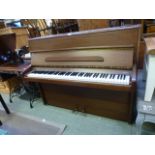 A mahogany cased upright piano by Knight