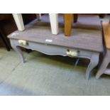 A decorative blue painted coffee table w