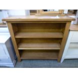 An oak low wide open front bookcase (88.