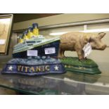 A Titanic door stop together with a pig