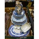A tray of blue and white tableware to in