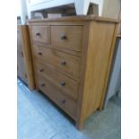 An oak two over three drawer chest of dr