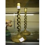 A pair of brass barley twist candlestick