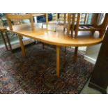 A teak extending dining table