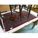 A small red eastern rug