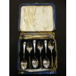 A set of six silver teaspoons in case, a