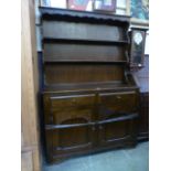 A mid-20th century oak dresser having pl