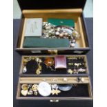 A jewellery box containing an assortment