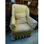 An early 20th century oak framed arm chair