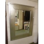 A substantial silver framed bevelled glass rectangular mirror